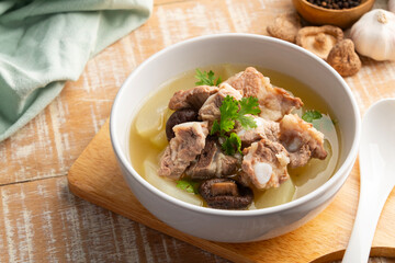 Winter Melon Soup With Pork Bone ribs in white bowl.