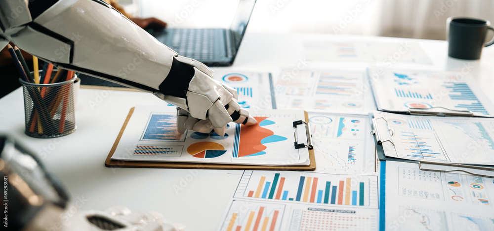 Poster a robotic hand closely examines business charts and graphs on a clipboard in a modern office. the sc