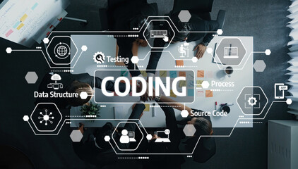 A dynamic coding session captured from above, featuring a group of professionals collaborating on software development, displaying technology elements and innovative ideas. Amity