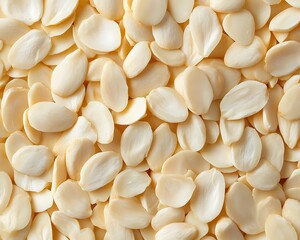 Close up view showcasing a pile of blanched almonds, highlighting the natural texture and color of the blanched almonds, perfect for culinary and health related visuals featuring blanched