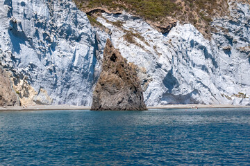 Scenic view of Ponza with rocky cliffs, turquoise sea and clear blue sky, coastal landscape of...