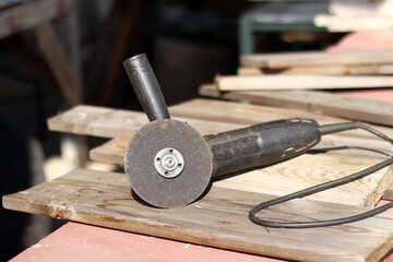 Angle grinders, power tools for construction and repair work. Tool for cutting and grinding hard...