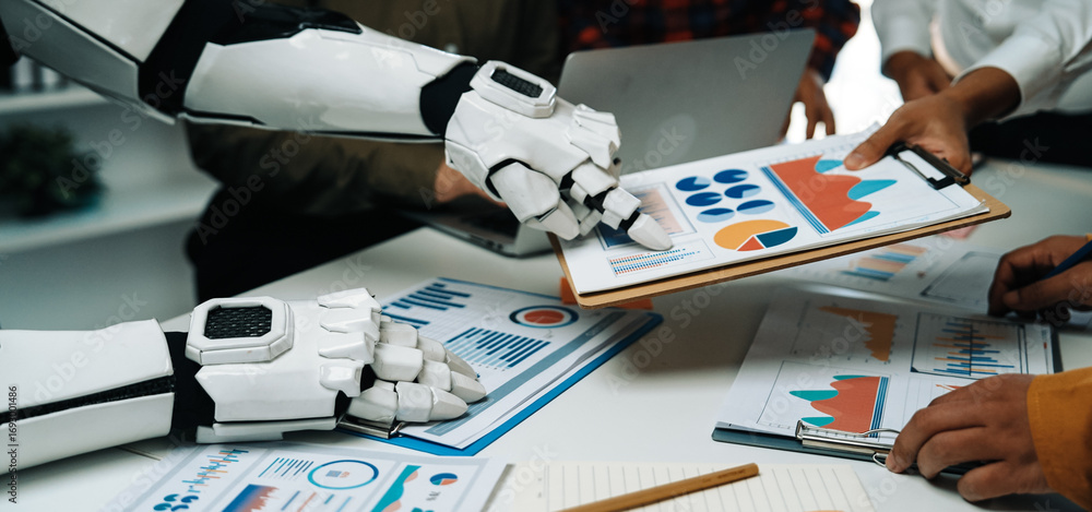 Poster a robotic arm assists a group of professionals in analyzing data, showcasing the integration of tech