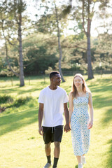 Obraz premium Romantic Interracial Couple Outdoors in Summer