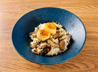 Black Truffle and Scallop Risotto with Creamy Sauce in bowl top view of Hong Kong food