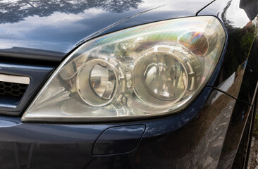 Foggy yellow car headlight. Yellow car headlight. Foggy Car headlight 