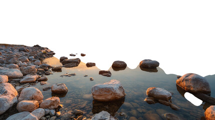 Sunrise over lake with stones reflecting in calm water, panoramic view isolated on transparent background 
