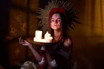 Mysterious woman adorned with a feather headdress and ritualistic face paint holding a tray of...
