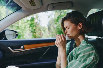 Car, woman, interior, calm scene shows a woman seated in the car seat with hands near the steering wheel, focused mood, serene anticipation, ready for a journey ahead.