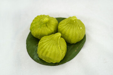 Modak is an Indian sweet dumpling offered to Lord Ganapati on Ganesh Chaturthi or Lord Krishna on Janmastami Festival. Served in a plate. Selective focus