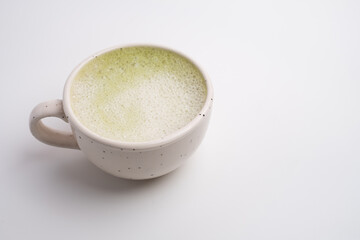 Cup of fresh matcha latte close-up on table. Antioxidants. Healthy nutrition