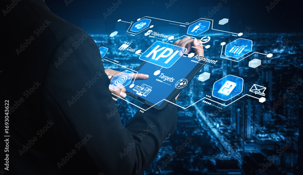 Poster a business professional interacts with a digital tablet displaying key performance indicator metrics