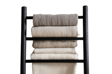 Modern black ladder towel rack with a stack of folded neutral blankets.