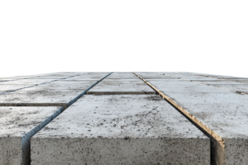 Perspective view of a gray concrete block pavement surface.