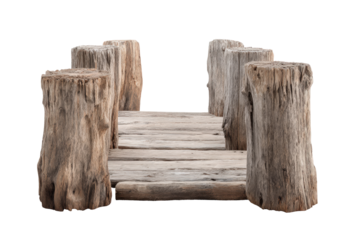 A rustic old wooden bridge made of logs and planks.