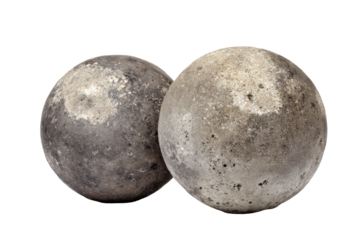 Two old round lead cannonballs with a weathered surface.