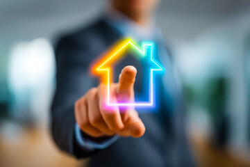 Business professional interacting with a colorful digital home icon projection