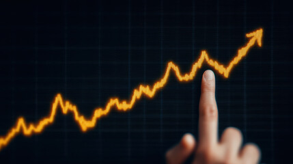 Gold price surge, Gold price surge is highlighted by finger pointing at rising financial graph symbolizing growth and investment success