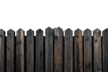 Old weathered dark wooden picket fence isolated on white.