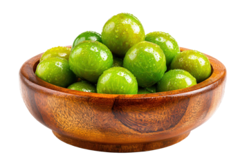 A rustic wooden bowl filled with fresh wet green limes.