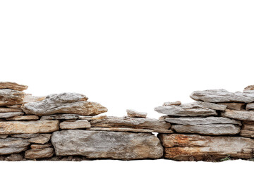 Old rustic dry stone wall made of stacked natural rocks.