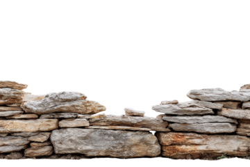 Old rustic dry stone wall made of stacked natural rocks.