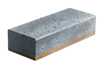 Single gray concrete paving block with rust stains.