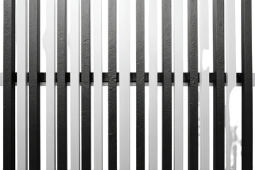High Contrast Black and White Vertical Striped Fence Pattern.