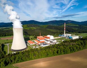 Aerial view of a power plant amidst rolling hills
