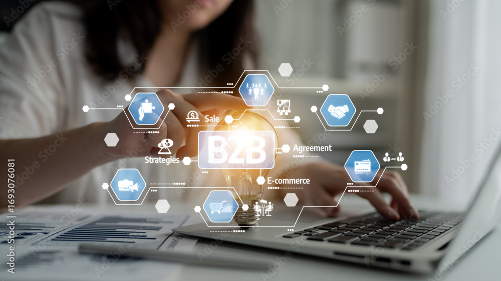 Poster a business professional focuses on b2b e-commerce strategies while working on a laptop. digital tech