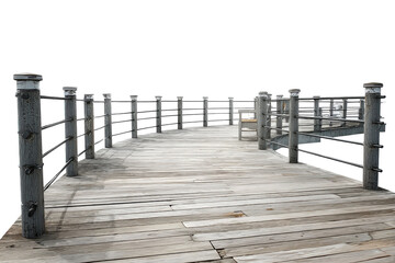 Naklejka premium An old weathered wooden pier with metal railings isolated.