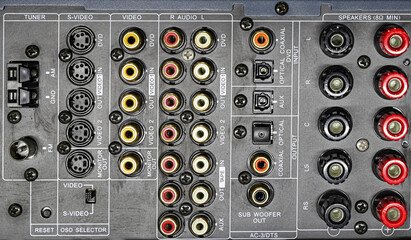 audio receiver back panel with inputs output for connecting equipment and output to speakers with terminals and wires