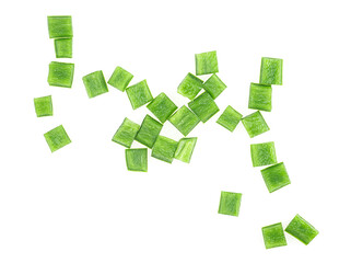 Green bell pepper pieces isolated on a white background, top view. Green paprika cubes.