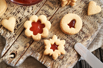 Homemade Linzer Christmas cookies filled with strawberry marmalade