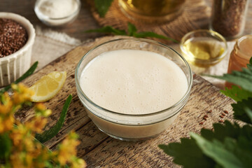 DIY shampoo made of homemade flax seed gel, argan oil, apple cider vinegar, nettle and coco...