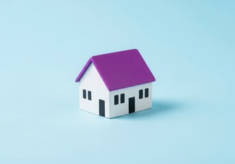 A small, simple house with a purple roof on a light blue background