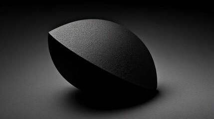 Geometric Abstract Composition Featuring a Textured Black Form in a Minimalist Setting