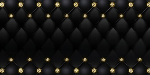 Fototapeta premium A black leather quilted background with gold diamond embellishments.