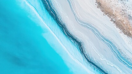 Aerial view captures the mesmerizing transition from turquoise sea to light sand shorelines