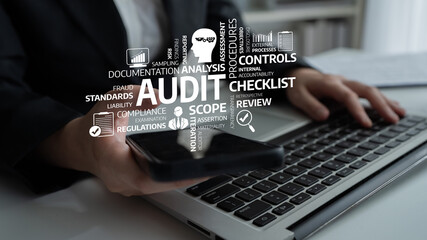 A professional audit concept depicting hands-on interaction with technology. The image illustrates...