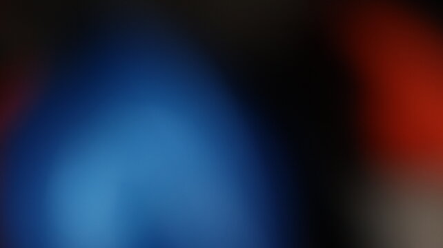 Blurred blue to red gradient on dark abstract canvas with soft transitions and moody visual contrast
