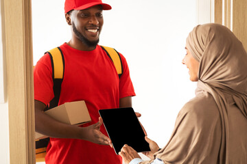 Courier Service Concept. Muslim Female Customer Receiving Order, Signing Electronic Form Or Receipt...