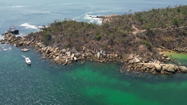 A drone video circling one end of Roqueta Island in Acapulco, capturing its rugged terrain and the aftermath of Hurricane Otis from various angles