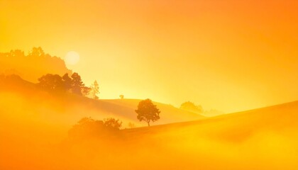 Obraz premium Golden-orange misty landscape with rolling hills, scattered trees, and fading mountain ridges