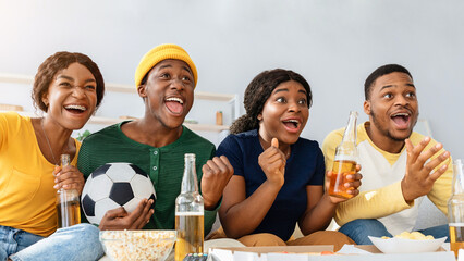 Closeup portrait of happy black friends football fans watching game at home, gesturing and screaming. Emotional african american men and women with soccer ball enjoying football game, panorama