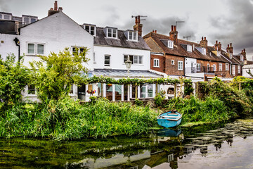 Houses and boat on the river in Canterbury, England