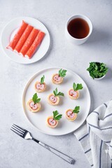 Omelette egg roll with imitation crab meat filling, tamagoyaki, in a plate