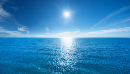 Obraz premium A Serene Ocean Scene With A Clear Blue Sky And A Calm Sunlit Sea With High Resolution