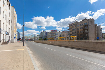 Yellow Tram on a City Street in Łódź.