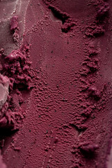 Close-up texture of rich red berry sorbet, vibrant and refreshing frozen dessert background